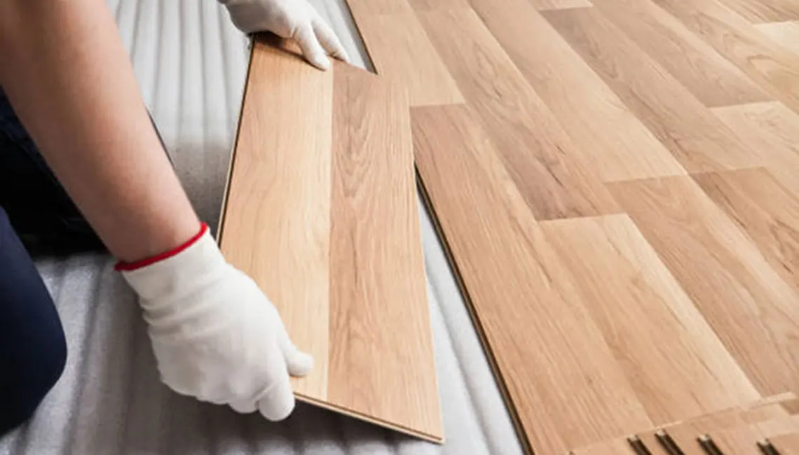 Flooring installation with hardwood floors in a living area