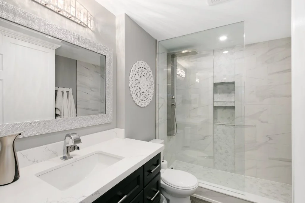 Modern bathroom renovation with new fixtures, tiles and shower